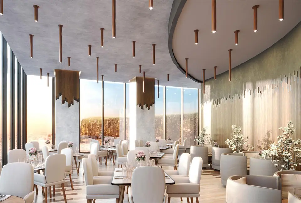 A restaurant with white chairs and tables in it