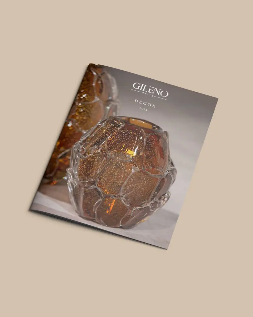 Catalog featuring an artistic glass vase on a beige background.