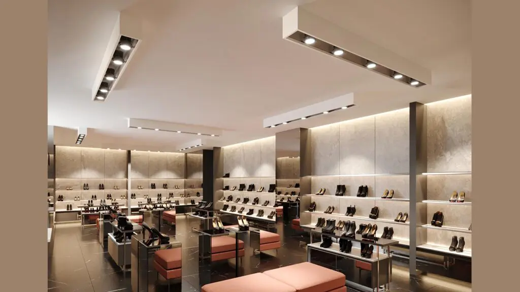 Modern shoe store with sleek displays and warm lighting.