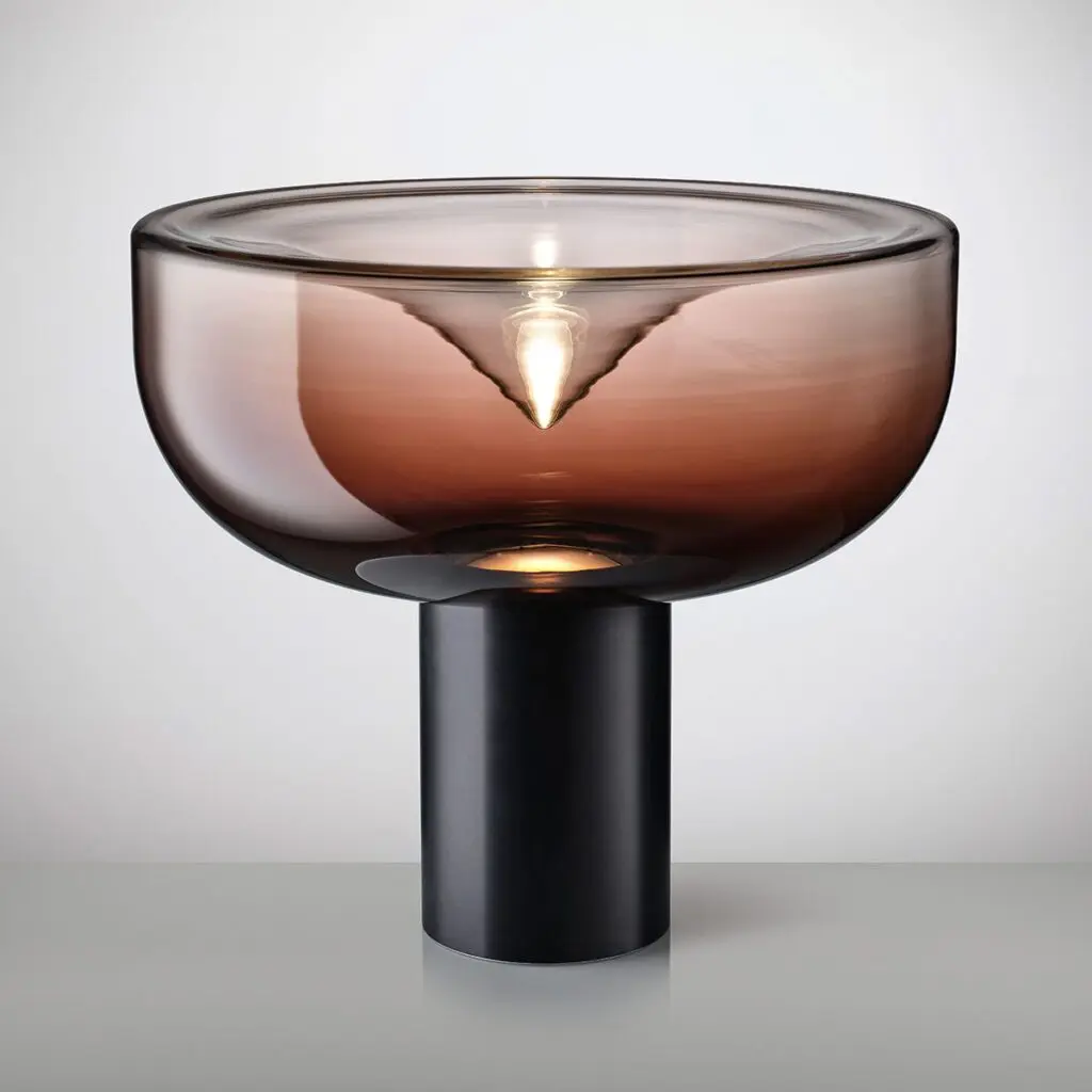 Modern glass lamp with a brown bowl-shaped shade and black cylindrical base.