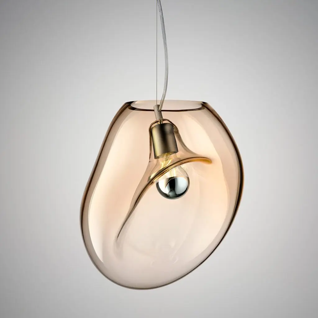 An artistic pendant light shaped like an abstract human face.